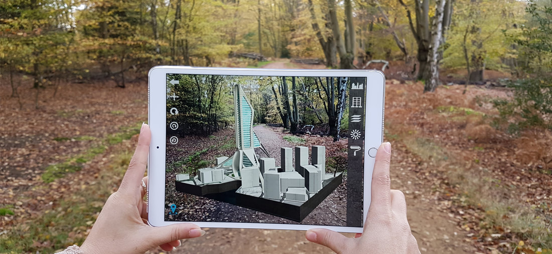 Genesis Augmented Reality Real Estate. Person holding a phone using augmented reality real estate mobile app.
